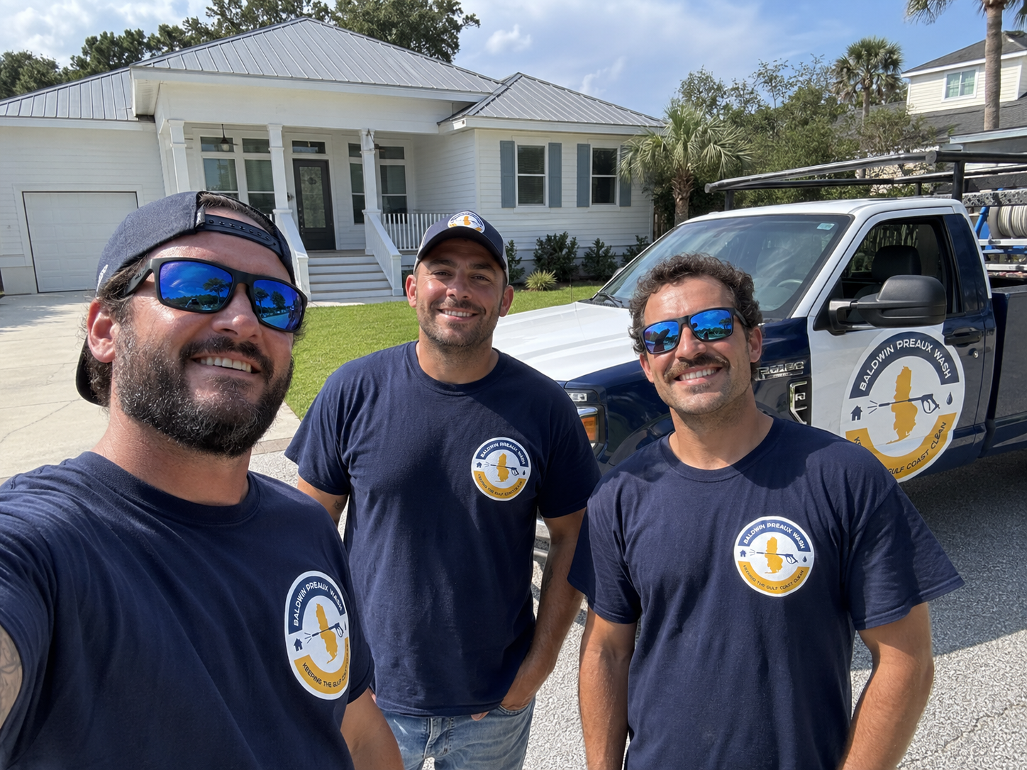 Technician brightening the face of a gutter on an Eastern Shore home