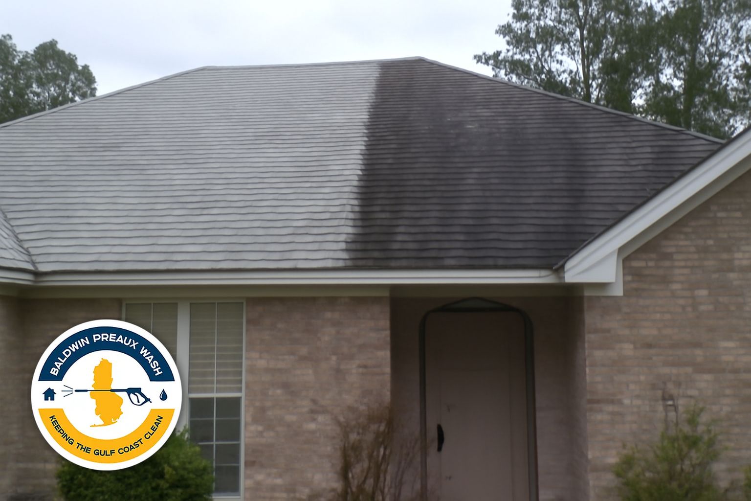 Baldwin Preaux Wash technician applying soft wash solution to a Gulf Coast home roof